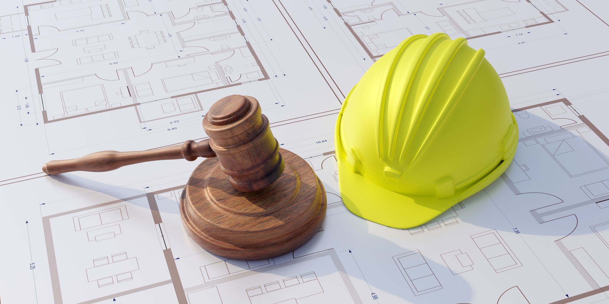 Labor, Construction law. Safety helmet and judge gavel on building blueprint